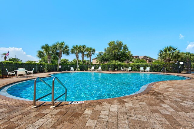 2065 Wilsons Plover Cir, Navarre, FL 32566 - community pool with a patio area