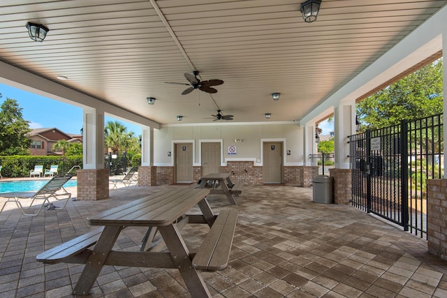 2065 Wilsons Plover Cir, Navarre, FL 32566 - view of patio with a community pool, a ceiling fan, and outdoor dining space