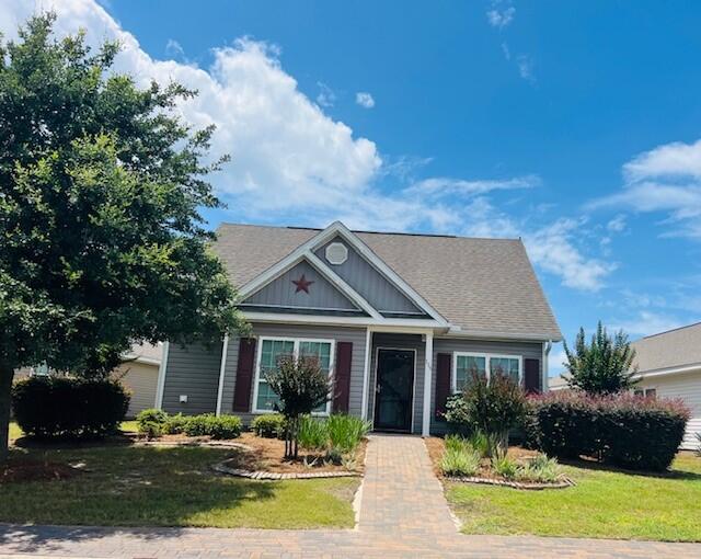 115 Lilly Bell Ln, Freeport, FL 32439 - view of front of home featuring a front lawn