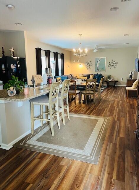 115 Lilly Bell Ln, Freeport, FL 32439 - dining room featuring wood finished floors, a chandelier, and recessed lighting
