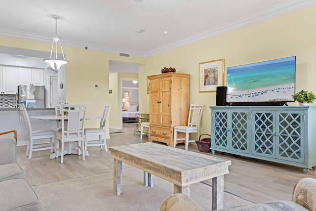 515 Topsl Beach Blvd # 401, Miramar Beach, FL 32550 - living area featuring light wood-type flooring, ornamental molding, and baseboards