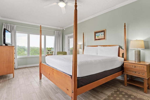 515 Topsl Beach Blvd # 401, Miramar Beach, FL 32550 - bedroom with crown molding, baseboards, light wood-type flooring, and ceiling fan