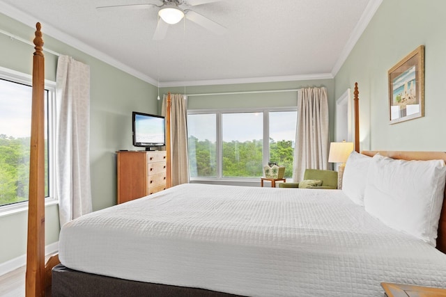 515 Topsl Beach Blvd # 401, Miramar Beach, FL 32550 - bedroom featuring multiple windows, ornamental molding, ceiling fan, and wood finished floors