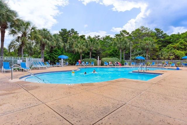 515 Topsl Beach Blvd # 401, Miramar Beach, FL 32550 - community pool with a patio area and view of scattered trees