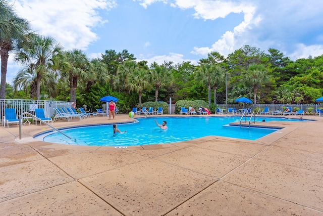 515 Topsl Beach Blvd # 401, Miramar Beach, FL 32550 - community pool featuring a patio and view of scattered trees
