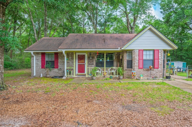 6256 Misty Ln, Crestview, FL 32539 - ranch-style home with covered porch, brick siding, and a shingled roof