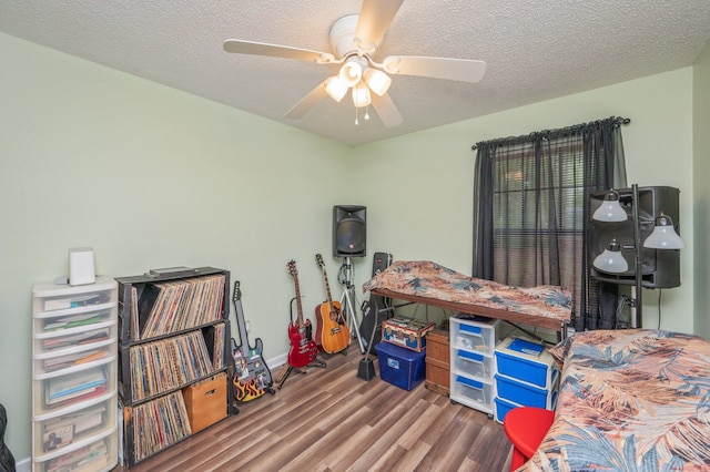 6256 Misty Ln, Crestview, FL 32539 - bedroom with wood finished floors, a textured ceiling, and a ceiling fan