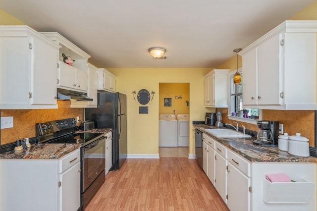6256 Misty Ln, Crestview, FL 32539 - kitchen with black appliances, washer and clothes dryer, a sink, and white cabinetry