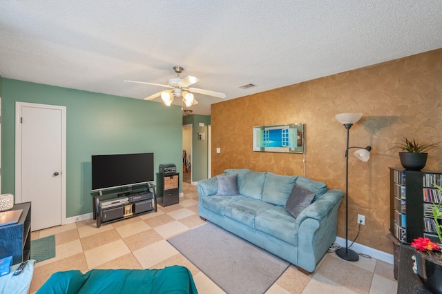 6256 Misty Ln, Crestview, FL 32539 - living area with a textured ceiling, tile patterned floors, baseboards, and a ceiling fan