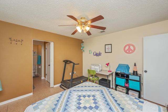 6256 Misty Ln, Crestview, FL 32539 - bedroom with a textured ceiling, baseboards, and a ceiling fan