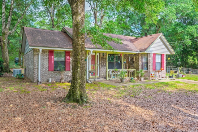 6256 Misty Ln, Crestview, FL 32539 - ranch-style home featuring brick siding, covered porch, central AC, and a shingled roof