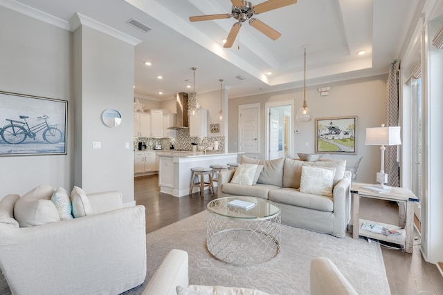 23 E York Ln Unit C, Inlet Beach, FL 32461 - living area with wood finished floors, a ceiling fan, crown molding, recessed lighting, and a tray ceiling