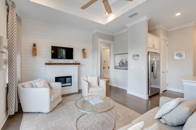 23 E York Ln Unit C, Inlet Beach, FL 32461 - living room featuring dark wood-style flooring, a ceiling fan, a glass covered fireplace, ornamental molding, and baseboards