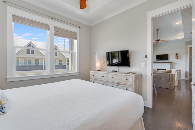 23 E York Ln Unit C, Inlet Beach, FL 32461 - bedroom featuring dark wood-type flooring, a fireplace, ornamental molding, baseboards, and a ceiling fan