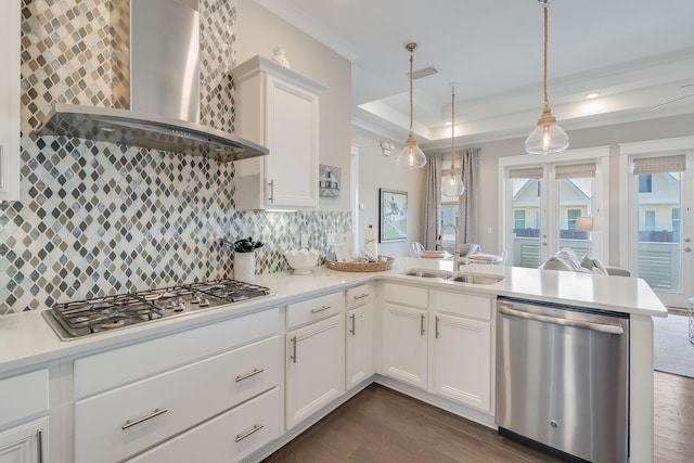 23 E York Ln Unit C, Inlet Beach, FL 32461 - kitchen with appliances with stainless steel finishes, wall chimney exhaust hood, a sink, a peninsula, and dark wood-style floors