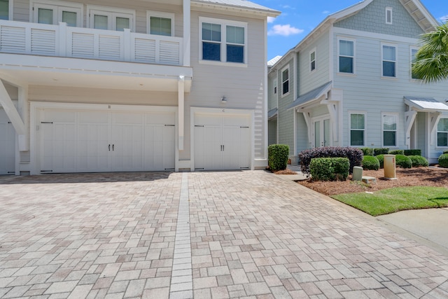 23 E York Ln Unit C, Inlet Beach, FL 32461 - townhome / multi-family property with an attached garage and decorative driveway