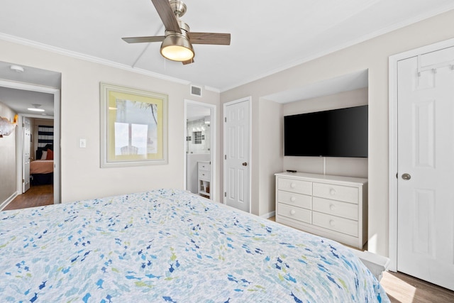 23223 Front Beach Rd # 913, Panama City Beach, FL 32413 - bedroom with wood finished floors, crown molding, baseboards, and a ceiling fan