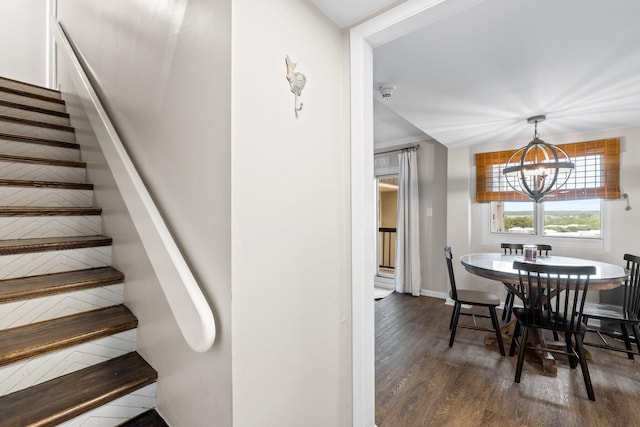 23223 Front Beach Rd # 913, Panama City Beach, FL 32413 - dining area with a chandelier, stairs, wood finished floors, and baseboards