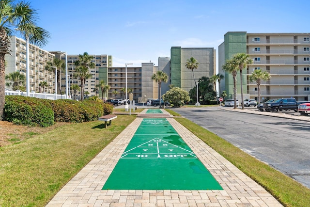 23223 Front Beach Rd # 913, Panama City Beach, FL 32413 - surrounding community with shuffleboard and a yard