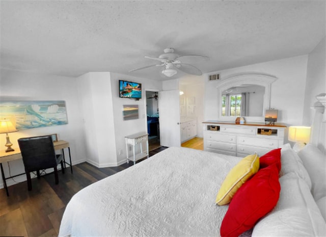 8966 Heron Walk Dr # 8966, Miramar Beach, FL 32550 - bedroom featuring wood finished floors, a ceiling fan, baseboards, and a textured ceiling
