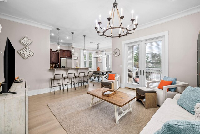 310 Morgans Trl, Santa Rosa Beach, FL 32459 - living room with a chandelier, crown molding, light wood finished floors, french doors, and recessed lighting