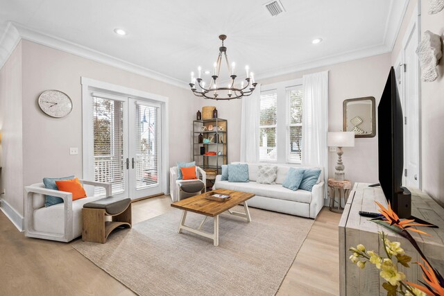 310 Morgans Trl, Santa Rosa Beach, FL 32459 - living area featuring plenty of natural light, light wood finished floors, crown molding, a chandelier, and recessed lighting