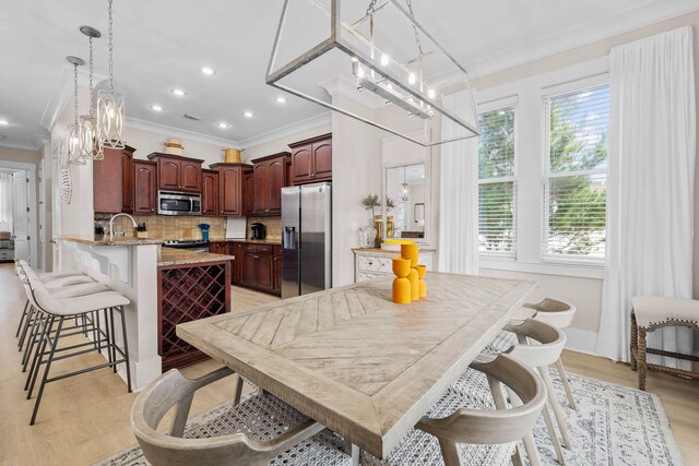 310 Morgans Trl, Santa Rosa Beach, FL 32459 - dining space featuring crown molding, healthy amount of natural light, light wood-style flooring, and recessed lighting