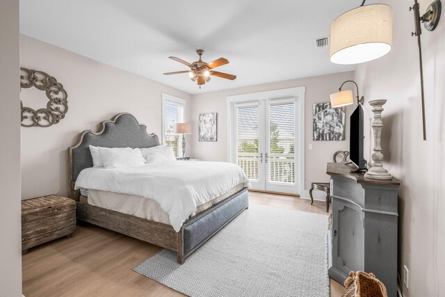 310 Morgans Trl, Santa Rosa Beach, FL 32459 - bedroom with access to exterior, light wood-style flooring, and ceiling fan