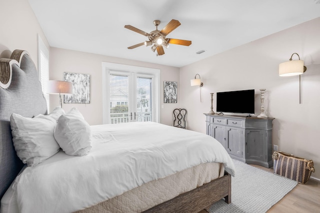 310 Morgans Trl, Santa Rosa Beach, FL 32459 - bedroom with light wood-style flooring, access to exterior, baseboards, and ceiling fan