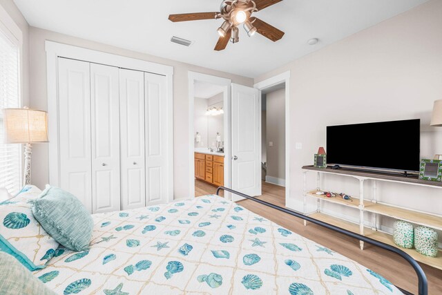 310 Morgans Trl, Santa Rosa Beach, FL 32459 - bedroom with light wood-style flooring, a closet, ceiling fan, and baseboards