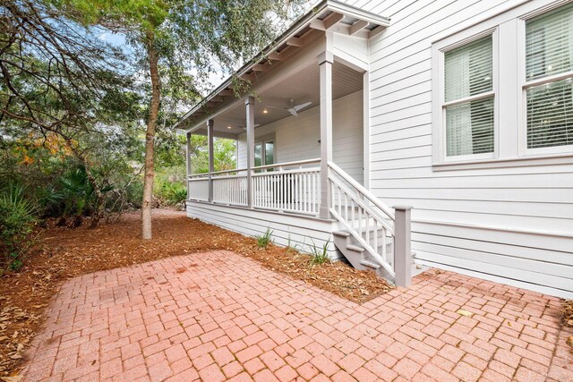 310 Morgans Trl, Santa Rosa Beach, FL 32459 - covered porch with a patio and a ceiling fan