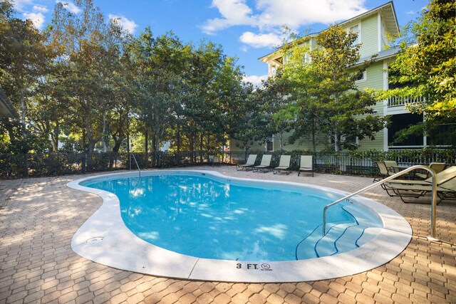 310 Morgans Trl, Santa Rosa Beach, FL 32459 - community pool featuring a patio