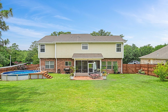 5416 Mill Brook Ln, Crestview, FL 32539 - back of house with a sunroom, brick siding, and a patio