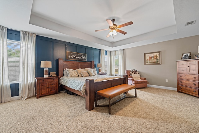 5416 Mill Brook Ln, Crestview, FL 32539 - bedroom with a raised ceiling, light colored carpet, baseboards, and ceiling fan