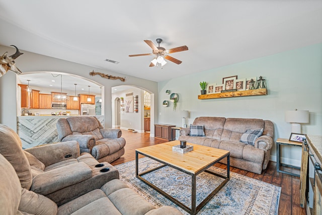 5416 Mill Brook Ln, Crestview, FL 32539 - living area featuring arched walkways, ceiling fan, hardwood / wood-style flooring, and baseboards