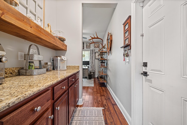 5416 Mill Brook Ln, Crestview, FL 32539 - bar area featuring dark wood-type flooring and baseboards