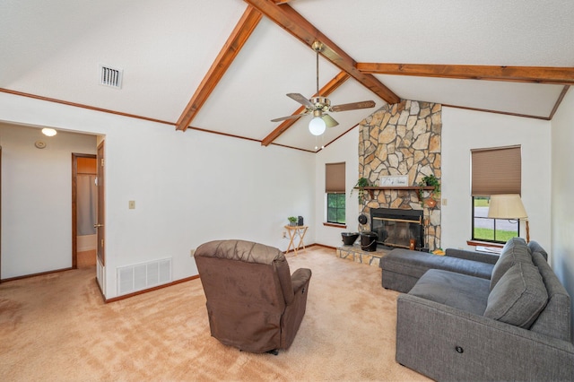 5951 N Meadow Ln, Crestview, FL 32539 - carpeted living area with beam ceiling, high vaulted ceiling, a ceiling fan, baseboards, and a stone fireplace