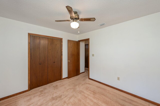 5951 N Meadow Ln, Crestview, FL 32539 - unfurnished bedroom with a closet, light carpet, baseboards, and ceiling fan