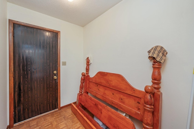 5951 N Meadow Ln, Crestview, FL 32539 - foyer entrance featuring a textured ceiling and baseboards