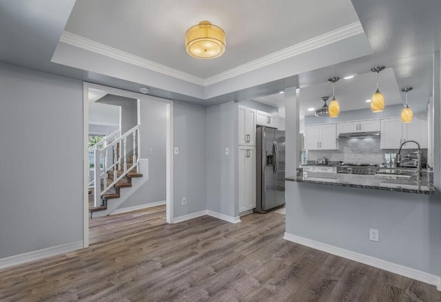 14 Winfield Way, Mary Esther, FL 32569 - kitchen featuring stainless steel fridge with ice dispenser, a sink, white cabinets, a peninsula, and dark stone counters