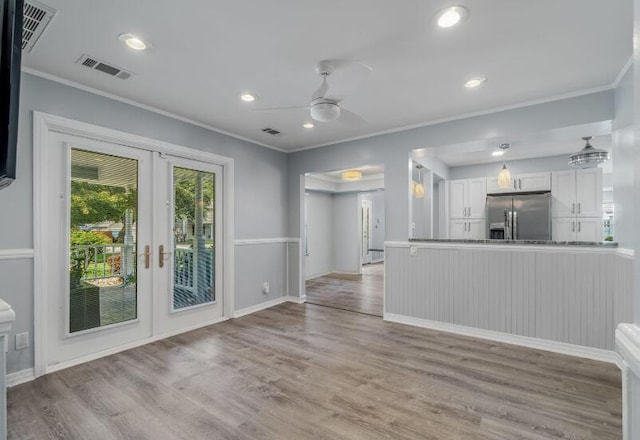 14 Winfield Way, Mary Esther, FL 32569 - kitchen featuring stainless steel refrigerator with ice dispenser, french doors, ornamental molding, ceiling fan, and white cabinets