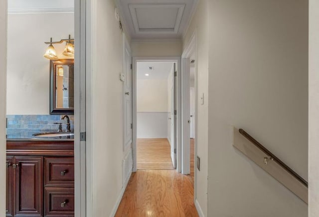 14 Winfield Way, Mary Esther, FL 32569 - hallway with light wood-type flooring, a sink, ornamental molding, and baseboards