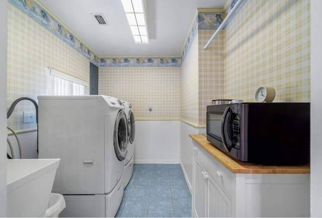14 Winfield Way, Mary Esther, FL 32569 - washroom featuring washer and clothes dryer, light tile patterned floors, wallpapered walls, and baseboards
