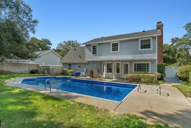 14 Winfield Way, Mary Esther, FL 32569 - rear view of house featuring a chimney, a patio area, and cooling unit