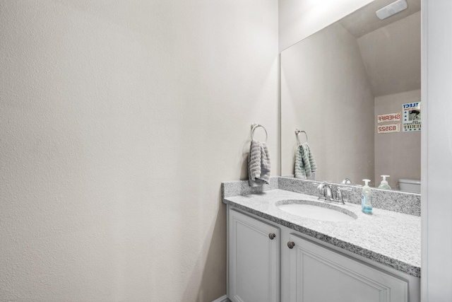 64 Crossing Ln Unit E, Santa Rosa Beach, FL 32459 - half bathroom featuring vanity and toilet