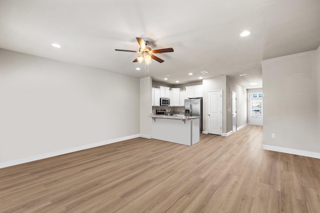 64 Crossing Ln Unit E, Santa Rosa Beach, FL 32459 - unfurnished living room featuring ceiling fan, baseboards, recessed lighting, and light wood-style floors