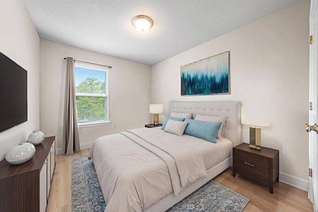64 Crossing Ln Unit E, Santa Rosa Beach, FL 32459 - bedroom featuring light wood finished floors and baseboards
