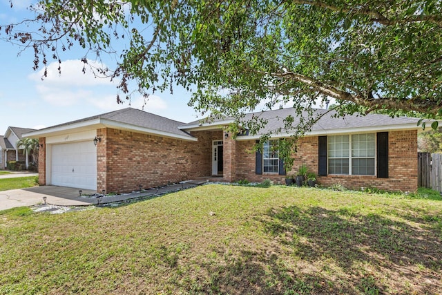 5123 Whitehurst Ln, Crestview, FL 32536 - single story home with a garage, brick siding, and driveway
