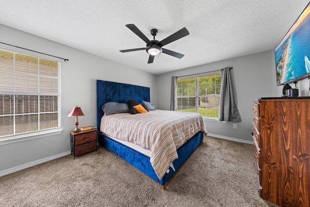 5123 Whitehurst Ln, Crestview, FL 32536 - carpeted bedroom featuring a textured ceiling and ceiling fan