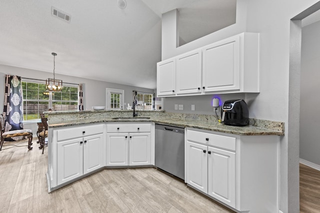 5123 Whitehurst Ln, Crestview, FL 32536 - kitchen with dishwasher, a peninsula, light wood-type flooring, and white cabinetry